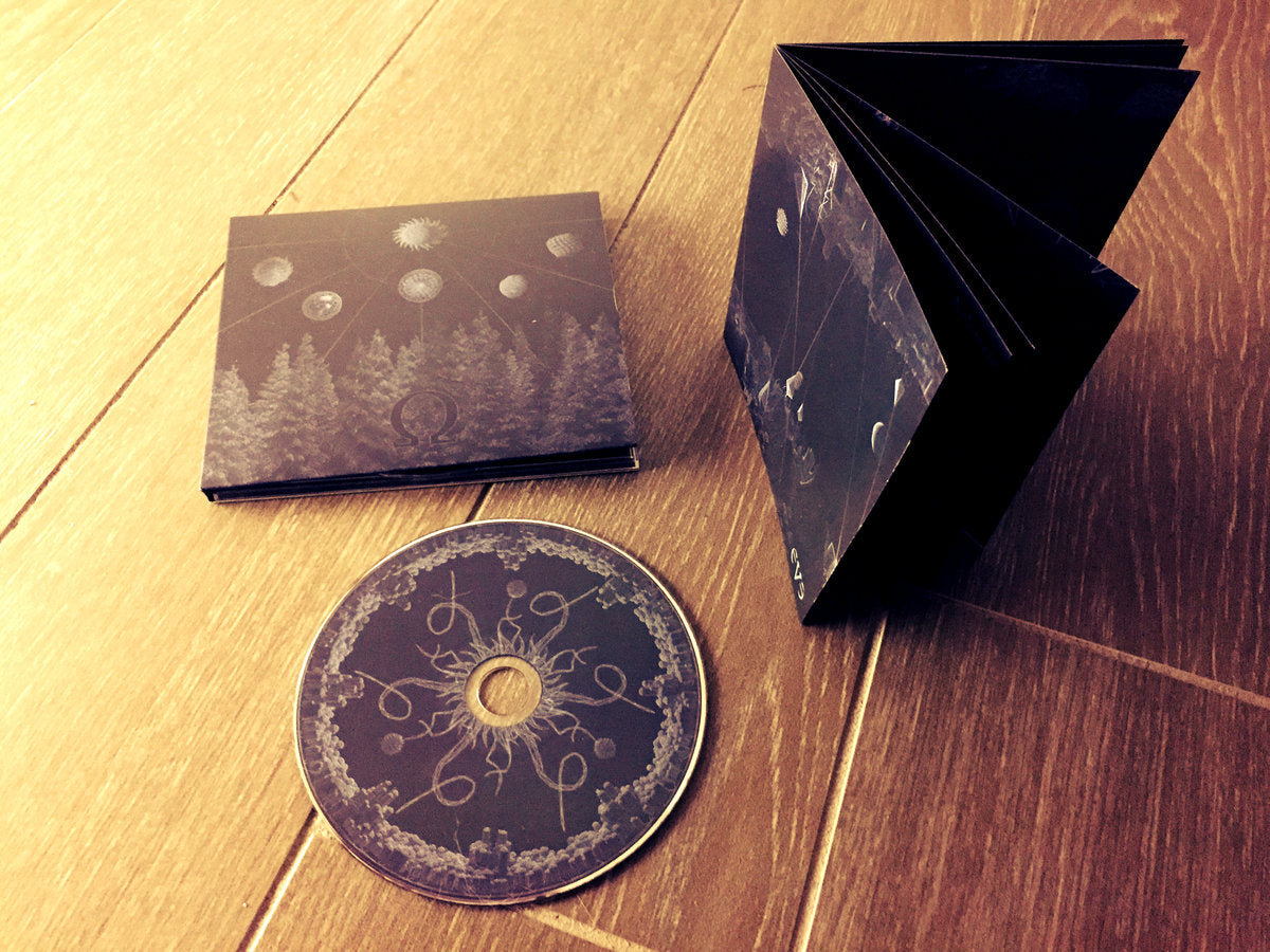 Omega Eve CD digipak m/16-siders hefte