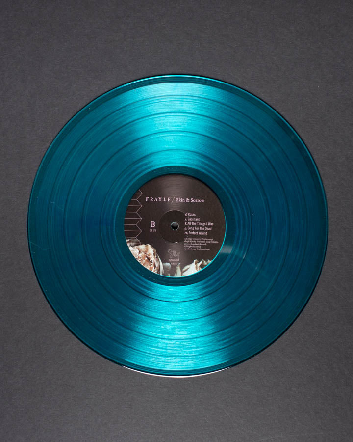 Frayle Skin & Sorrow vinyl turkis signert